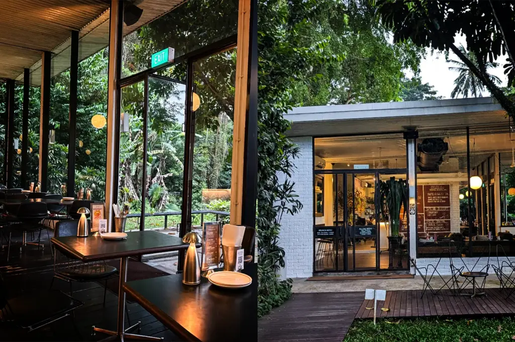 A side-by-side composite image, titled "4-Somerset Food The Ultimate Guide.webp", depicts the interior and exterior of a modern restaurant nestled in a lush, green environment. The left side showcases a semi-outdoor dining area with dark wooden tables, sleek black chairs, and small metallic table lamps, looking out through tall glass windows and a wide open doorway marked with an "EXIT" sign toward a dense, tropical jungle. The right side features an exterior view of the restaurant's white brick and glass storefront at dusk, illuminated by warm indoor lighting that reveals an inviting interior with menu blackboards, surrounded by overhanging trees, a wooden plank pathway, and a small grassy area with wireframe outdoor seating.
