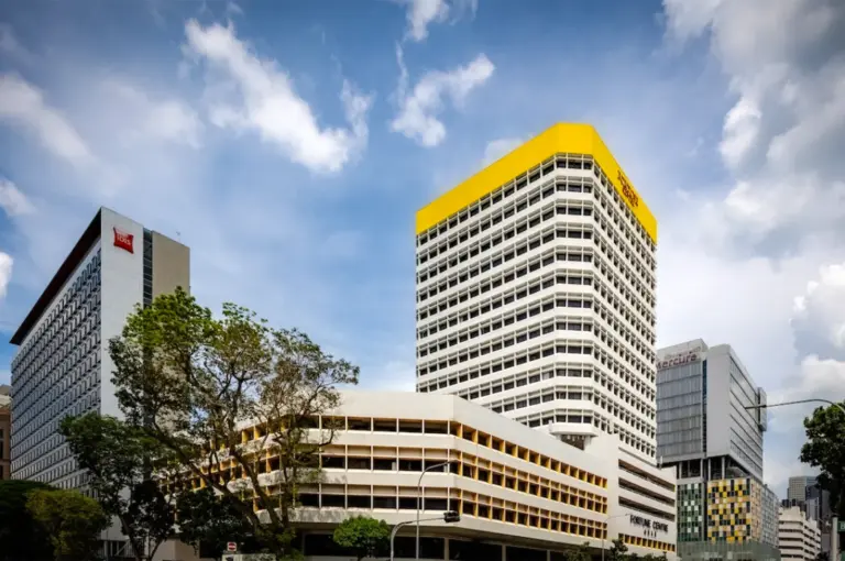 Fortune Centre building on Bencoolen Street in Singapore with surrounding hotels and city skyline under a bright sky