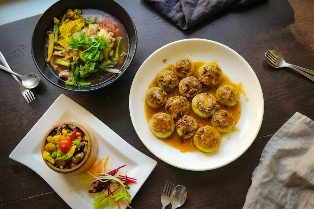 Vegetarian stuffed vegetables, herbal soup, and colorful plant-based dishes served at New Green Pasture Cafe Singapore