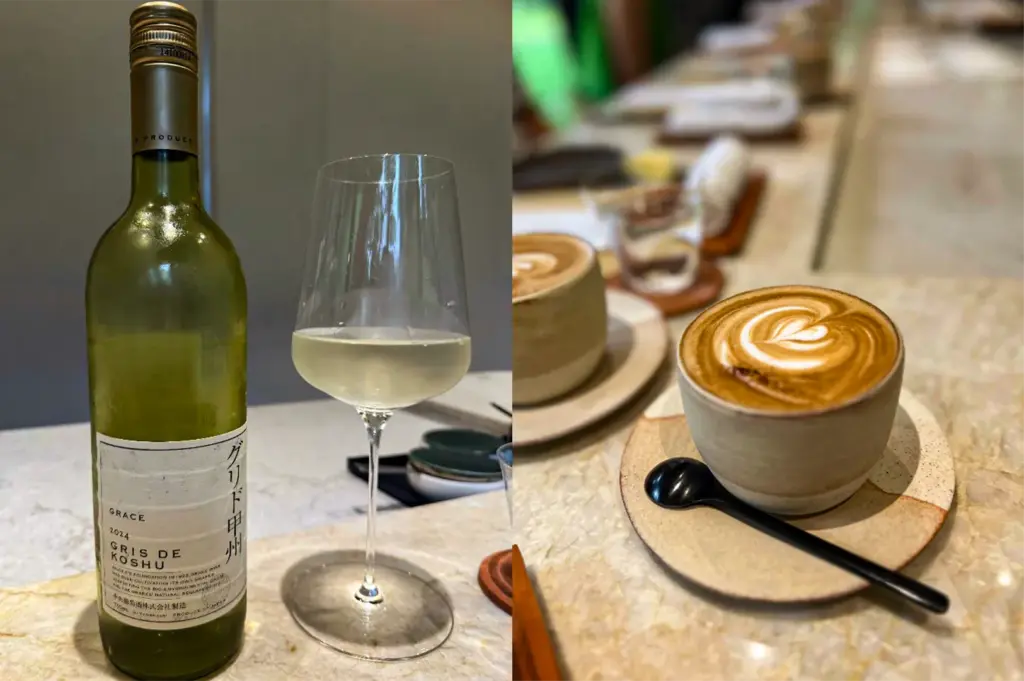 A side-by-side split composition captures a selection of premium beverages served at an upscale dining counter, representing the file "4-Ami Patisserie Orchard Elegant French-Japanese Pastries.webp". The left panel shows a close-up, eye-level view of a green glass bottle of Japanese wine labeled "Grace 2024 Gris de Koshu" standing next to a delicate crystal wine glass filled with a pale, straw-colored white wine. The right panel shifts to a close-up shot of a beautifully crafted hot latte featuring intricate heart-shaped latte art, served in a rustic, textured ceramic cup on a matching saucer with a small black spoon, while another coffee cup and a glass of water sit along the polished marble counter in the softly blurred background.