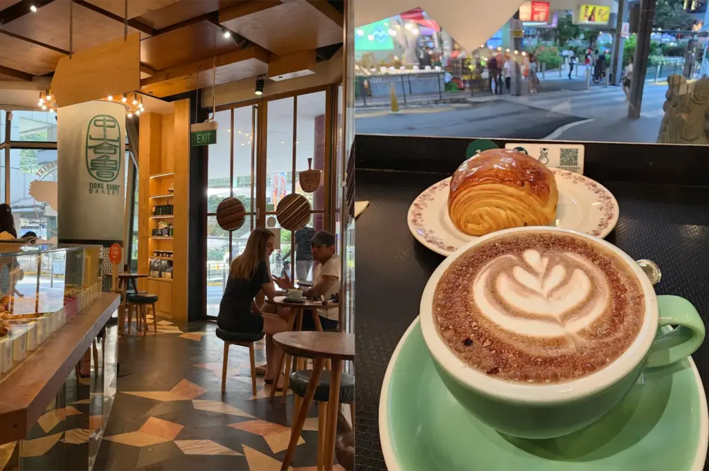 A split image showcases the warm wooden interior of a Tiong Bahru Bakery on the left, where customers sit near floor-to-ceiling glass windows. On the right, a hot cappuccino with latte art in a light green cup and saucer is paired with a flaky, golden pain au chocolat set against a window view of the street outside.